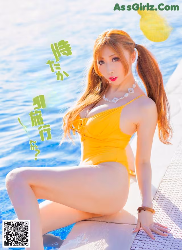 A woman in a yellow bathing suit sitting on the edge of a pool.